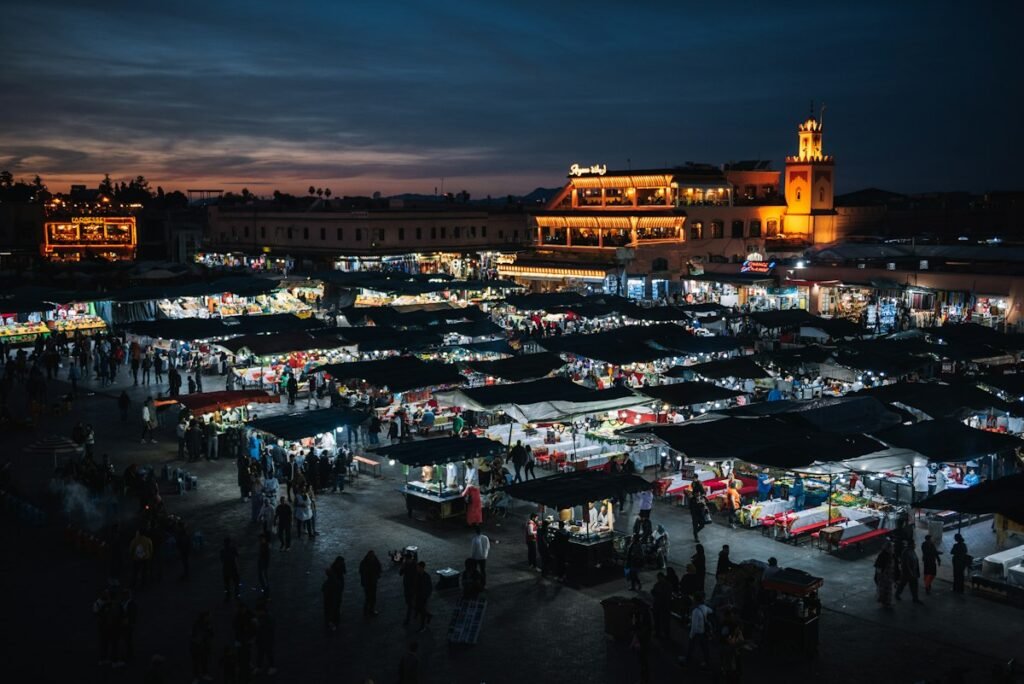 Jemaa el-Fnaa square lit up at night in Marrakech, where the luxury Morocco holiday starts and ends