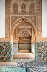 Carved stucco arch and zellige tilework in Marrakech