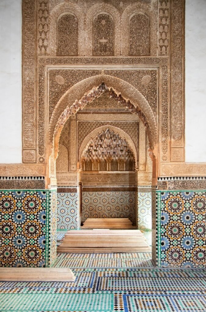 Carved stucco arch and zellige tilework in Marrakech