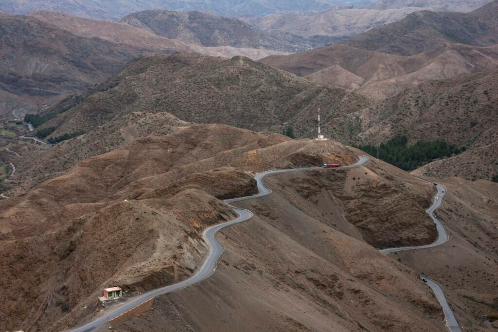 Road winding through brown mountains in Morocco